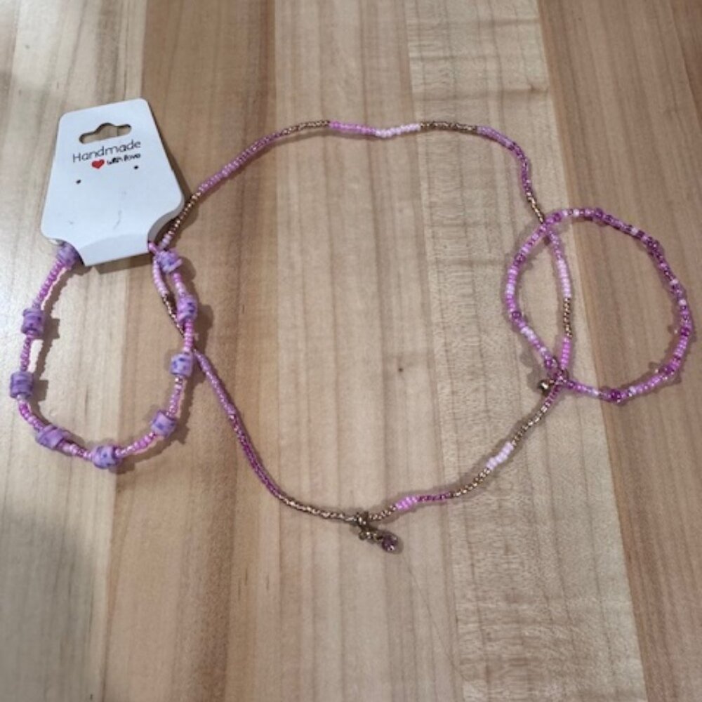 Matching set of two pink bracelets and one necklace